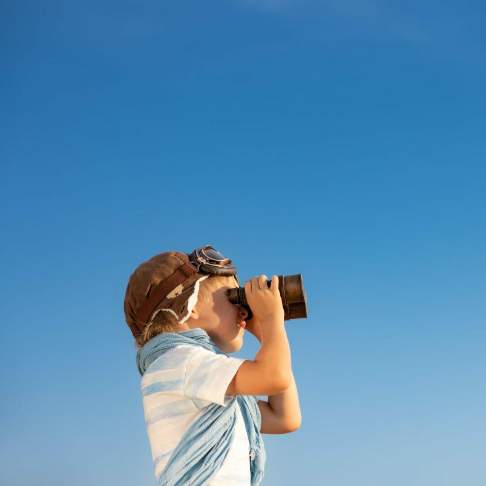 child-looking-through-binoculars-against-blue-sky-kid-having-fun-outdoor-summer-adventure-travel-concept child-looking-through-binoculars-against-blue-sky-kid-having-fun-outdoor-summer-adventure-travel-concept
